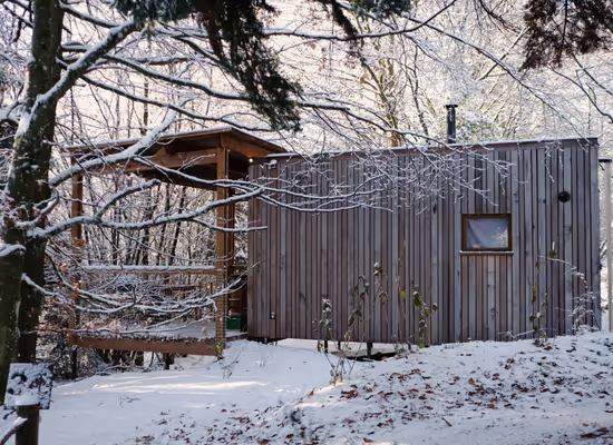 The Sweet forest cabin in the Ardennes outside with snow