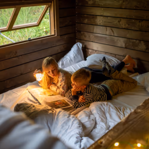Kids reading a book during kidsfriendly holidays in France