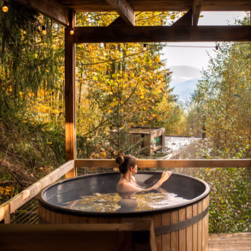 A lady relaxing in a hot tub during a wellness stay in Alsace