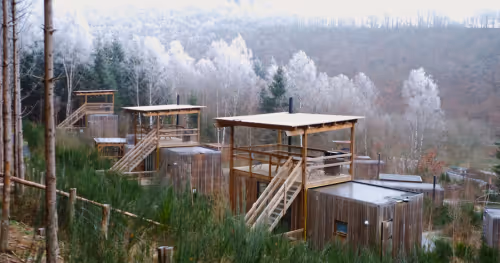 Multiple cabins in the woods in the Ardennes during Christmas holidays