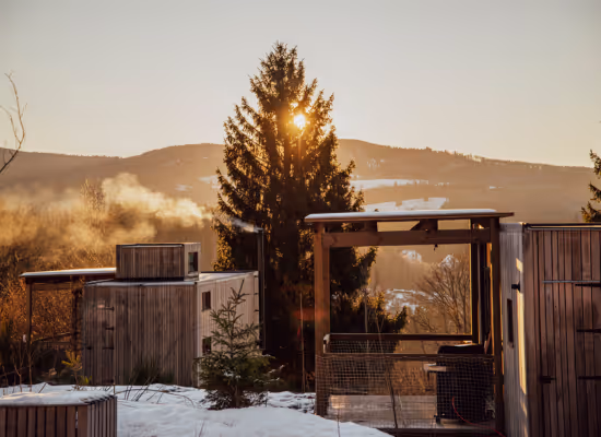 A cabin in the woods in Alsace, covered in snow and ready to welcome guests for their last-minute holidays