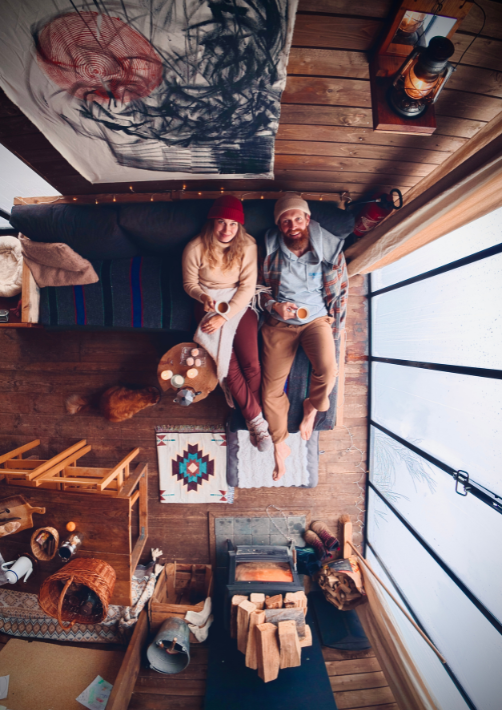 A couple on a romantic getaway in a cabin in the woods in Belgium