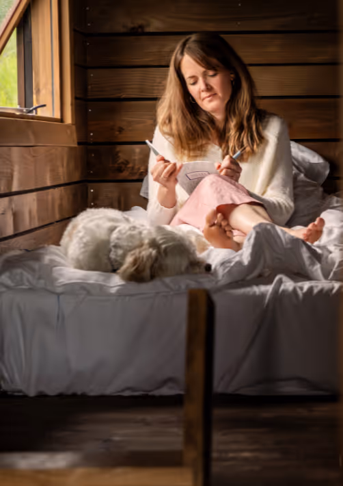 A woman journaling during a solo retreat