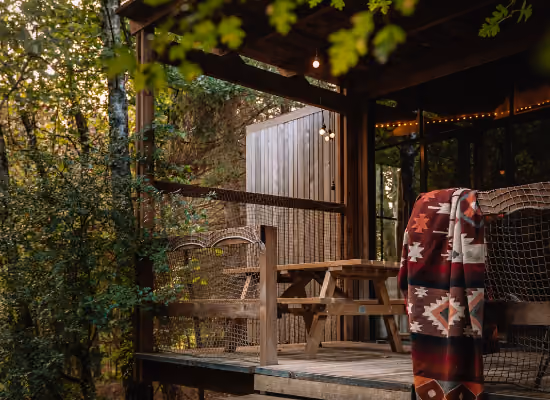 Terrace of a Classic cabin in the woods in the Ardennes in winter