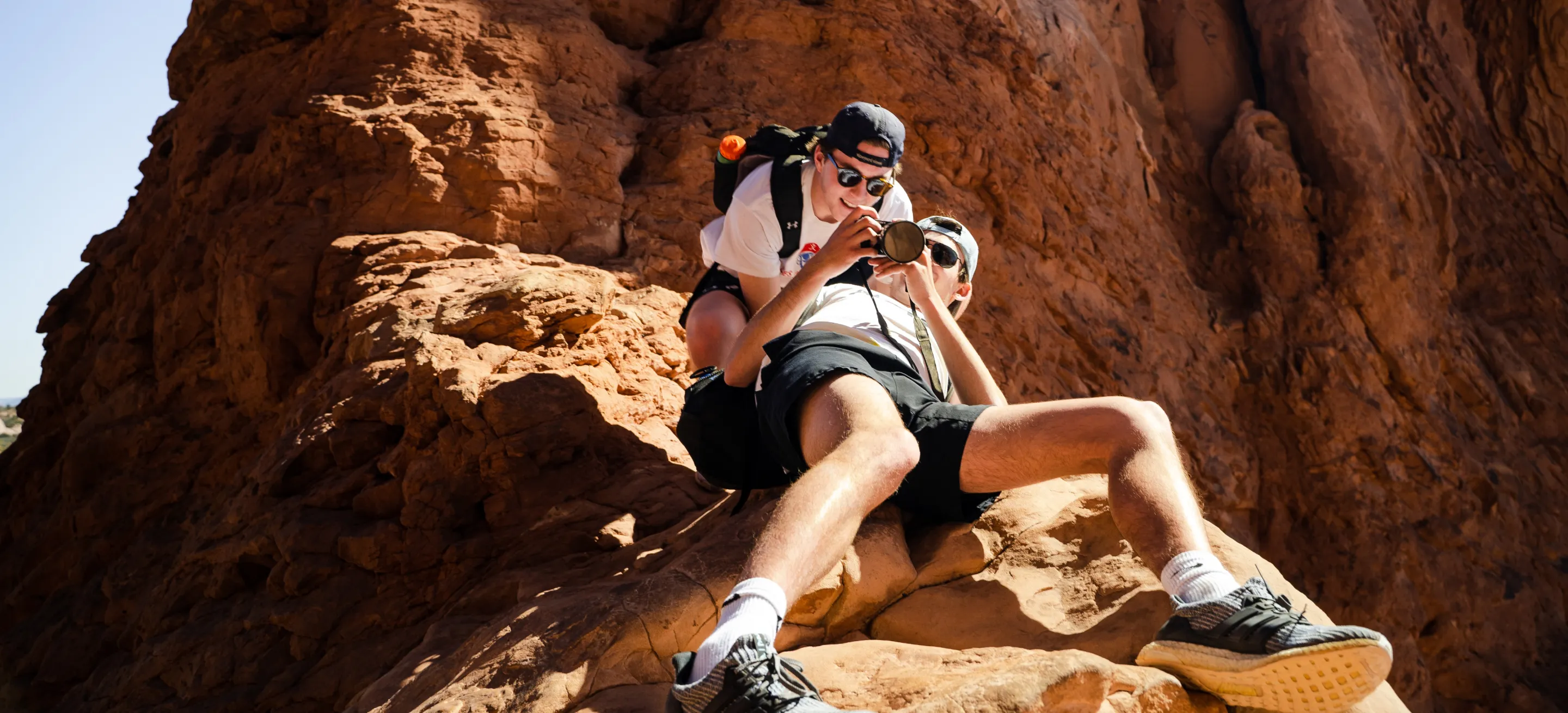 two photographers looking on camera choosing pactures
