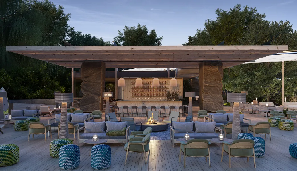 A patio with chairs, tables, and a fire place.