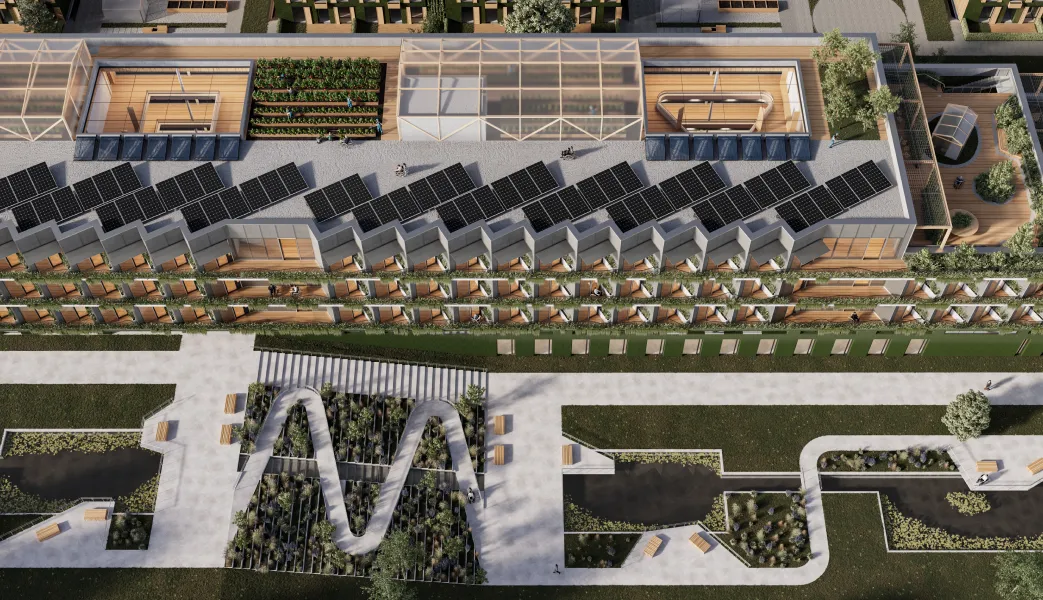 An aerial view of a building with solar panels on the roof.