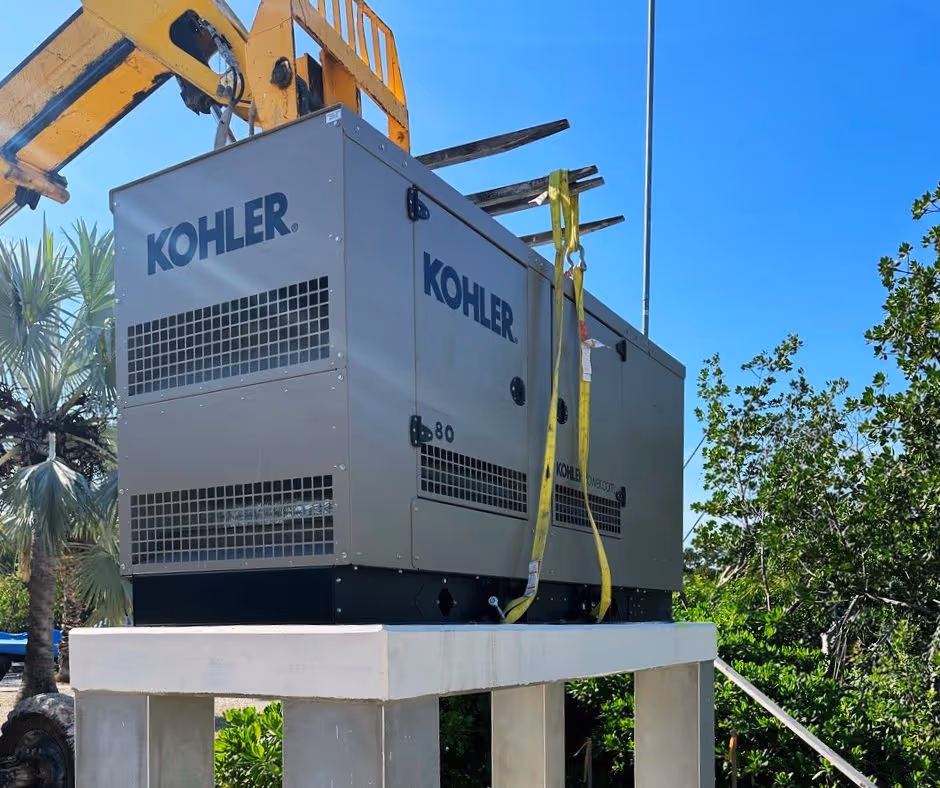 A forklift lifts a Kohler generator onto it's base during an Islamorada Power generator installation in the Florida Keys.