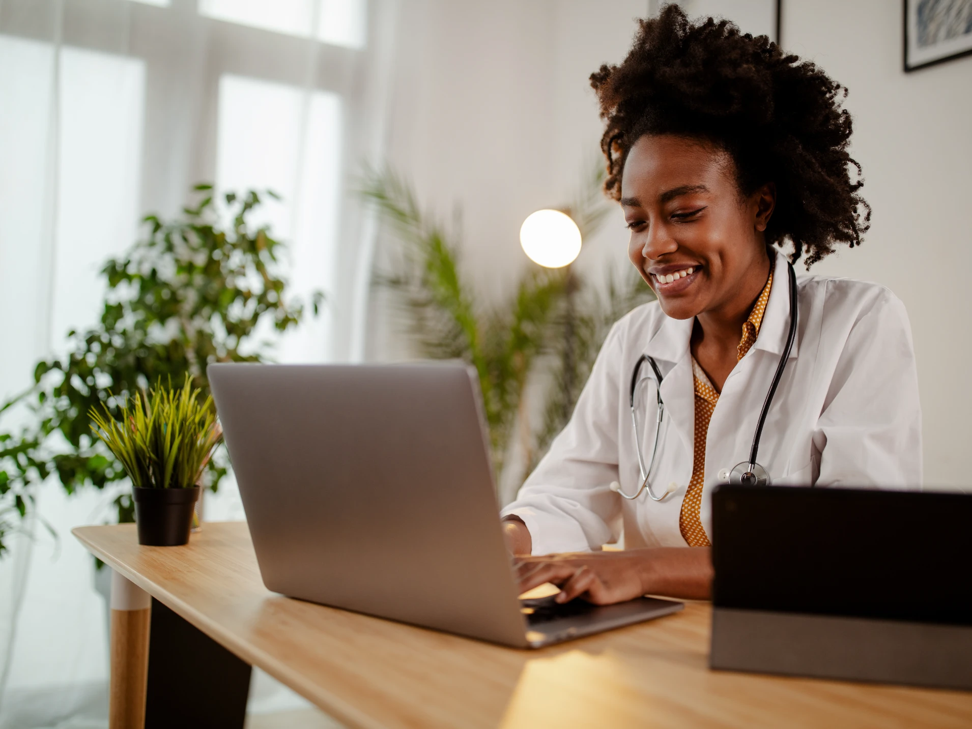 A licensed clinician conducting and online diagnosis/treatment appointment using their laptop.