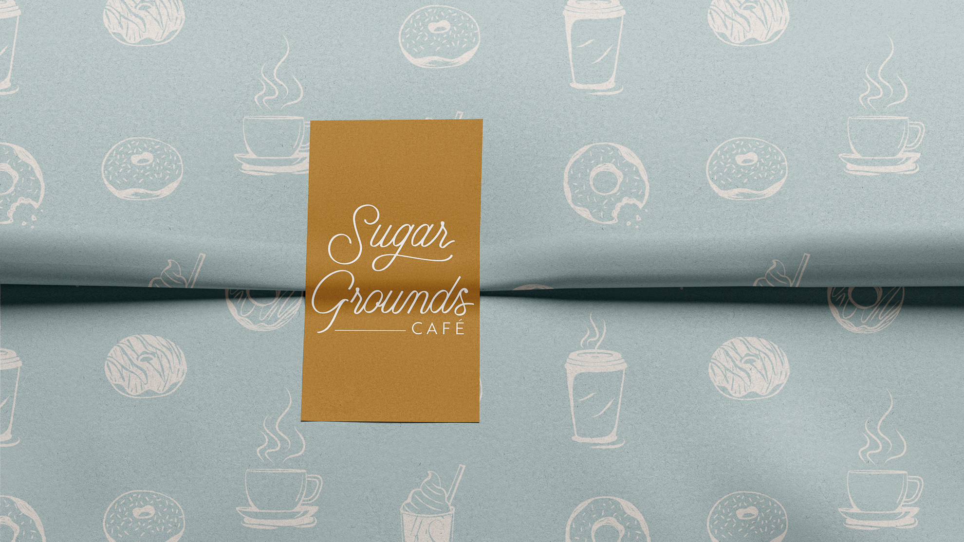 sticker and tissue paper with sugar grounds logo and pattern