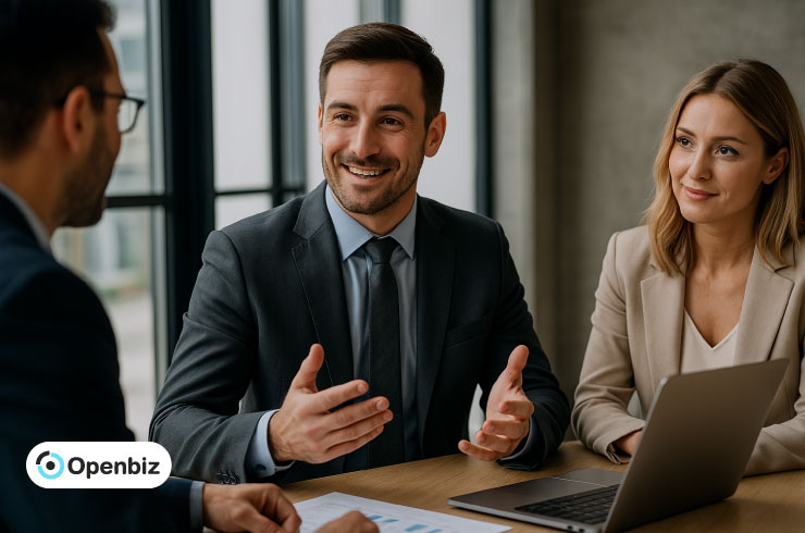 Smiling entrepreneurs in a meeting, discussing terms of their LLC Operating Agreement