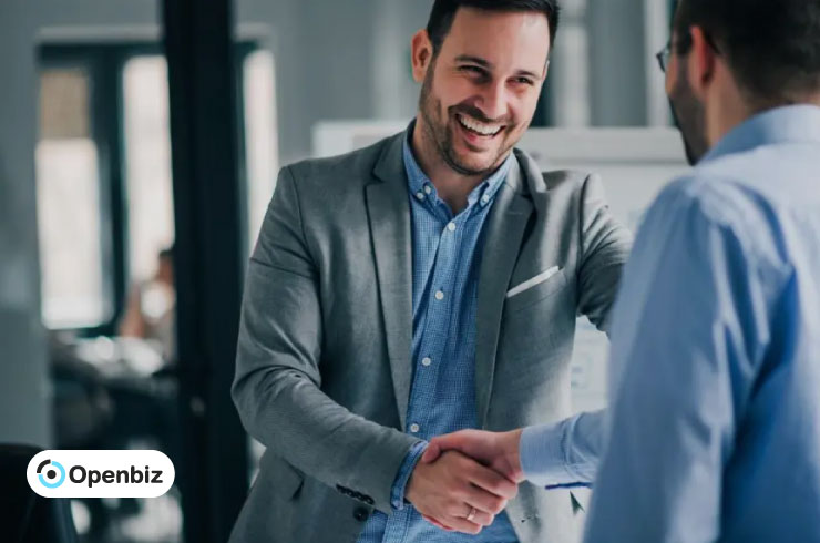 Entrepreneurs shaking hands after structuring business equity in a U.S. LLC