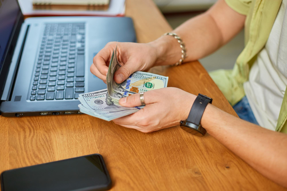 Business owner managing online payments and calculating professional service fees