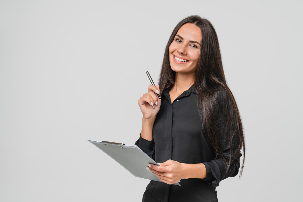 Professional accountant smiling and holding a tablet, representing accounting and tax consulting services.