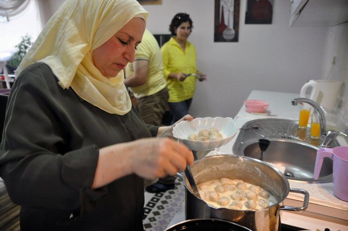 Samar al-Mallah preparing food.