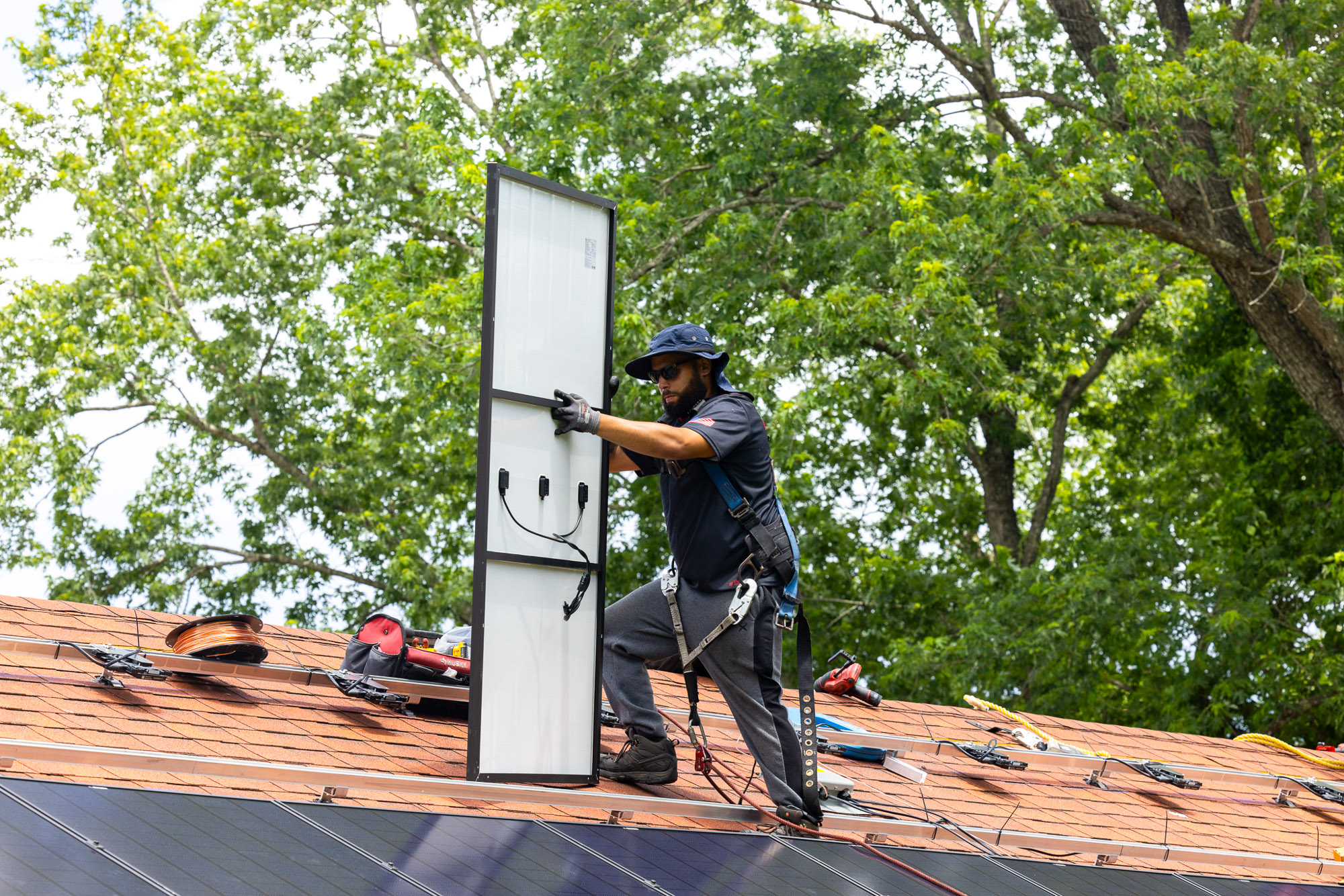 Team of solar technicians on residential job site