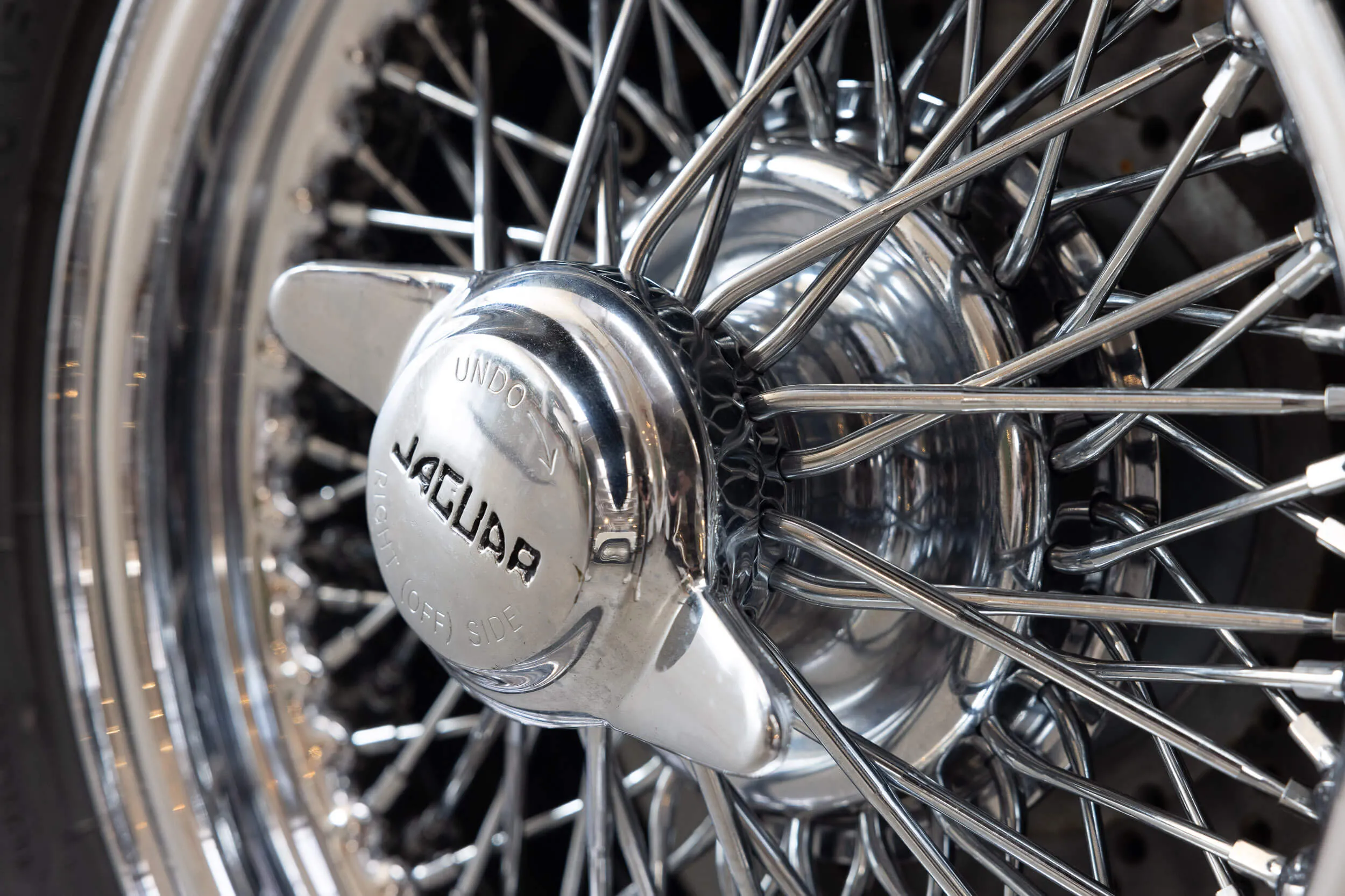 Detail wheel view of Jaguar E-Type Series 1 OTS 1967 Dark Blue