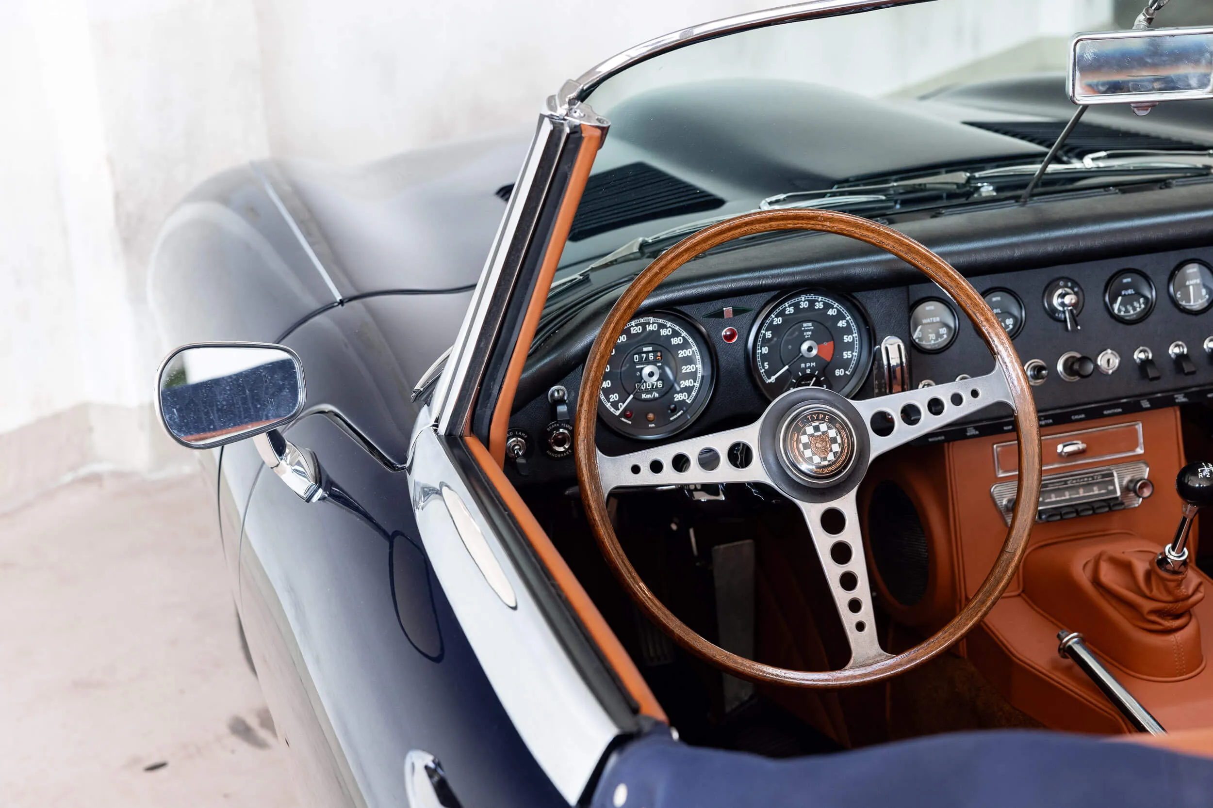 over shoulder driver's view of Jaguar E-Type Series 1 OTS 1967 Dark Blue