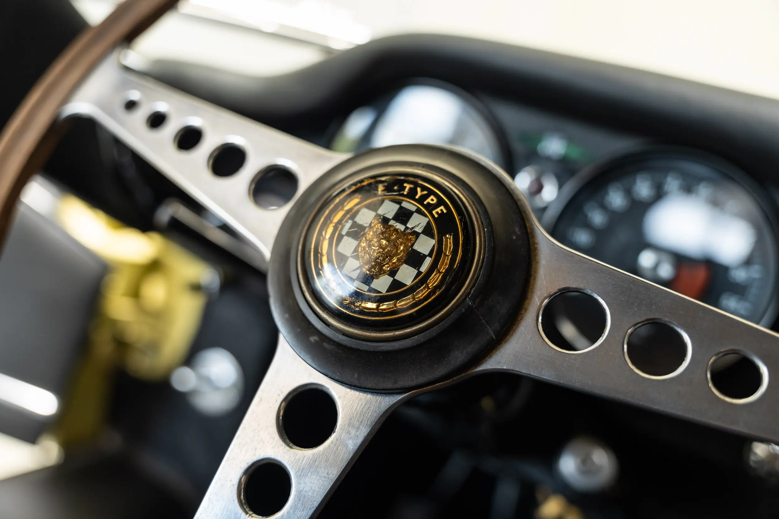 detailed view of steering wheel Oblique view of an Jaguar E Type OTS 