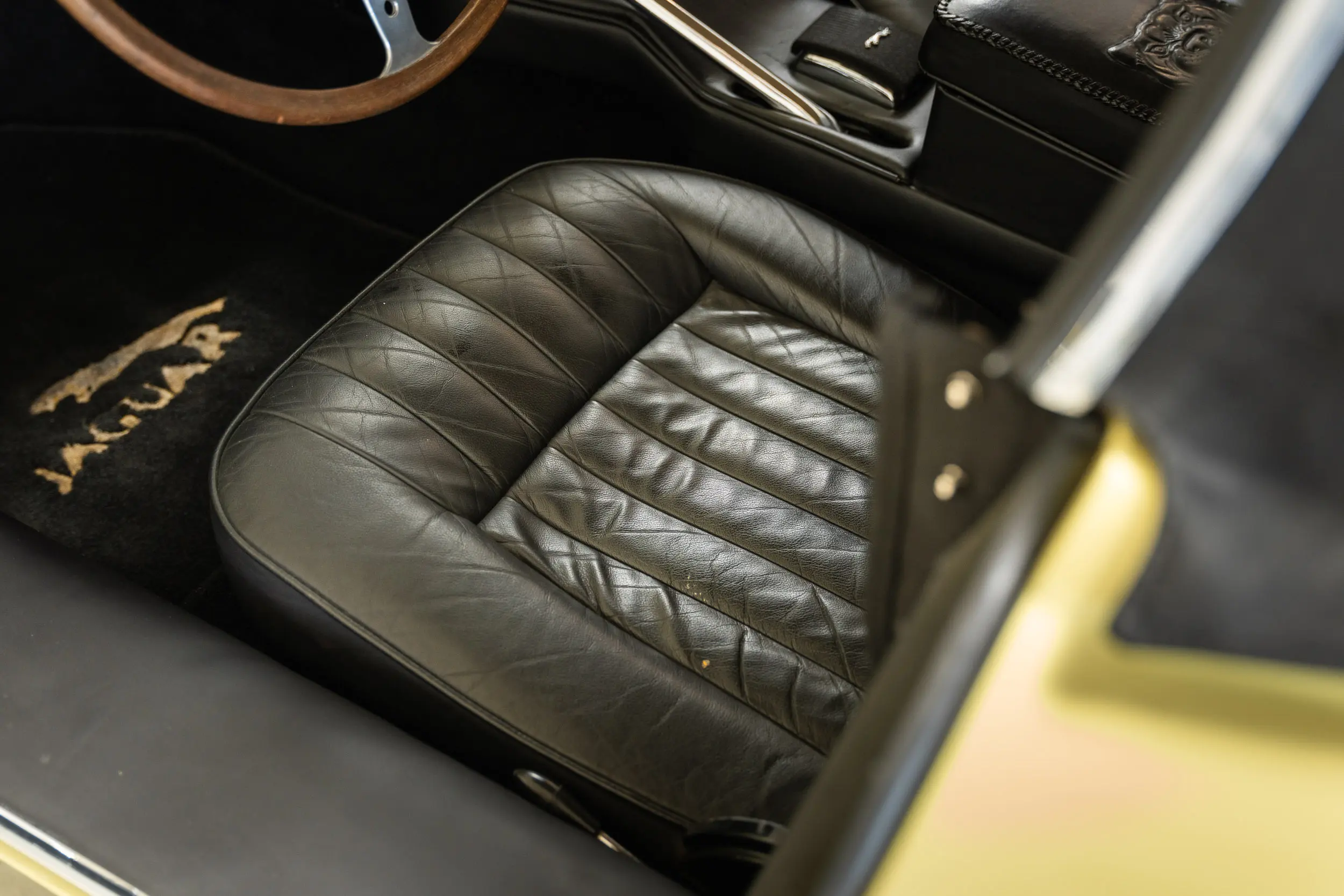 detailed view of leather upholstery Oblique view of an Jaguar E Type OTS 
