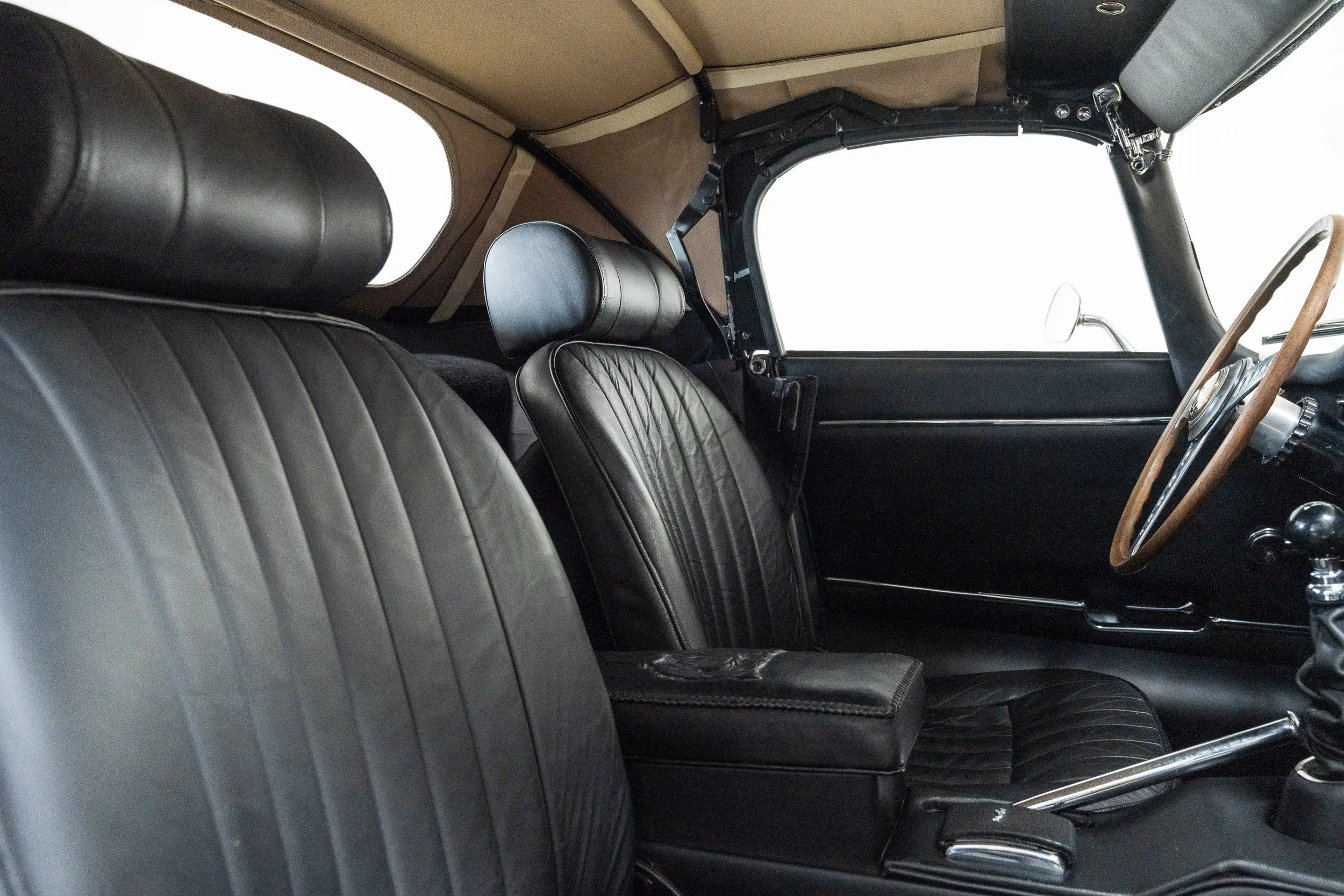 detailed view of seats with top up Oblique view of an Jaguar E Type OTS 