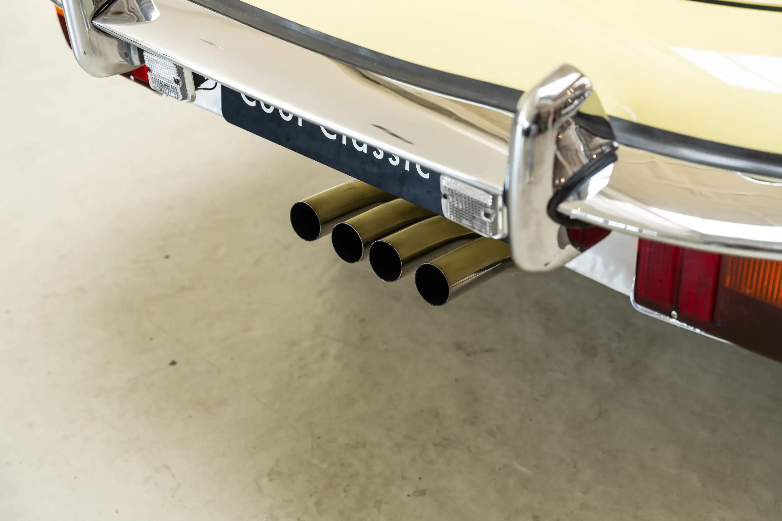detailed view of exhaust Oblique view of an Jaguar E Type OTS 