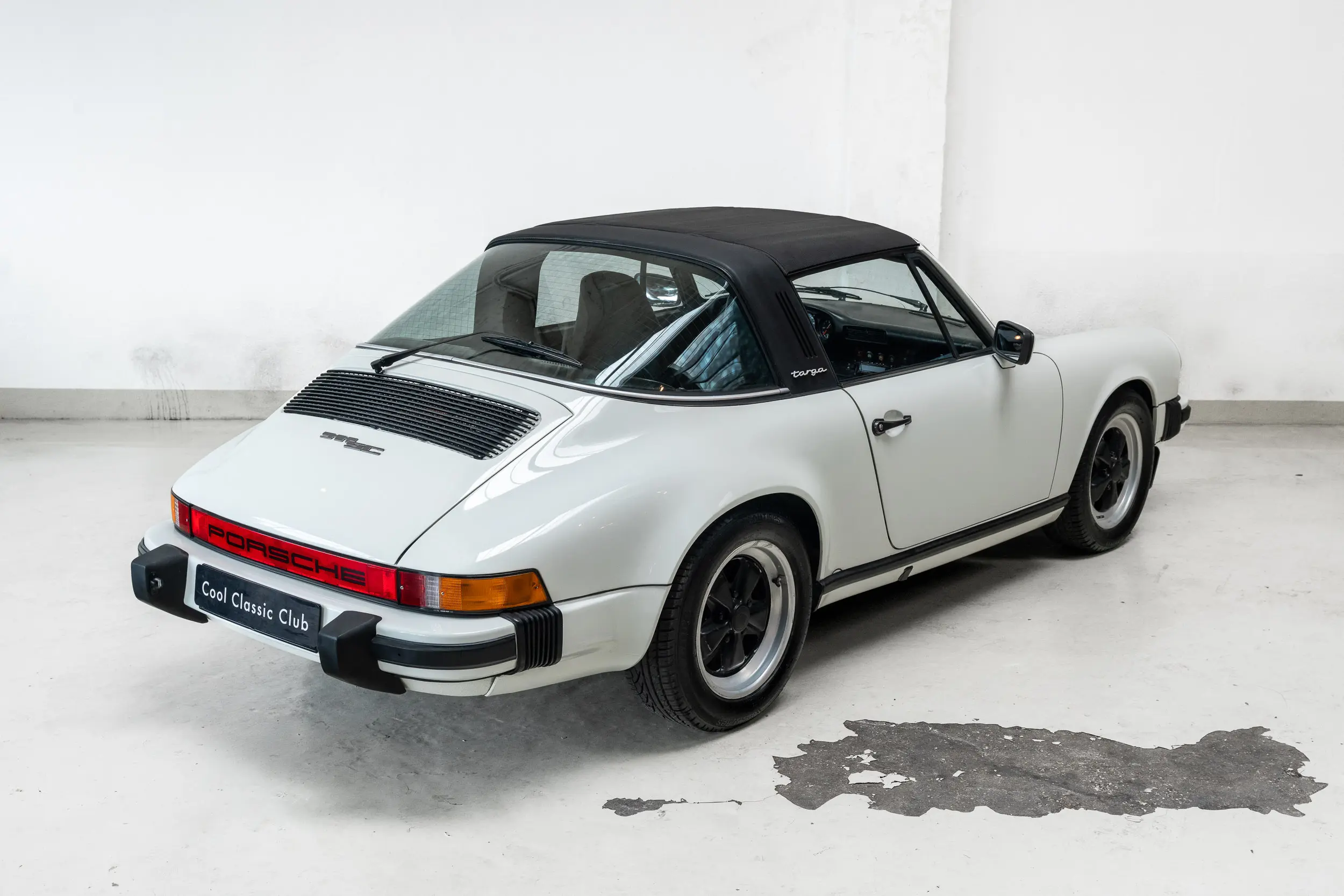 oblique rear overview with roof up of an Porsche 911 3.0 SC Targa