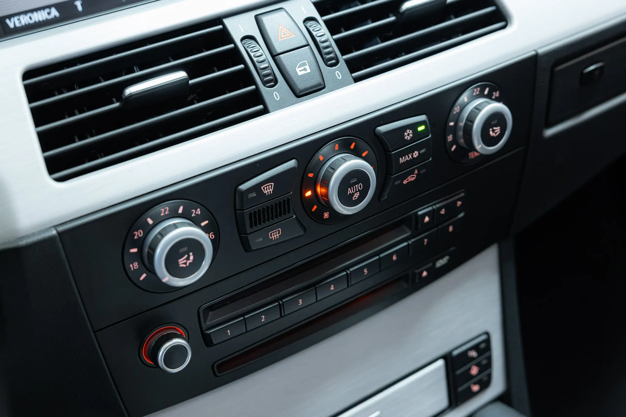 detailed view of controls on center console of the 2007 Schwarz BMW E61 M5 Touring