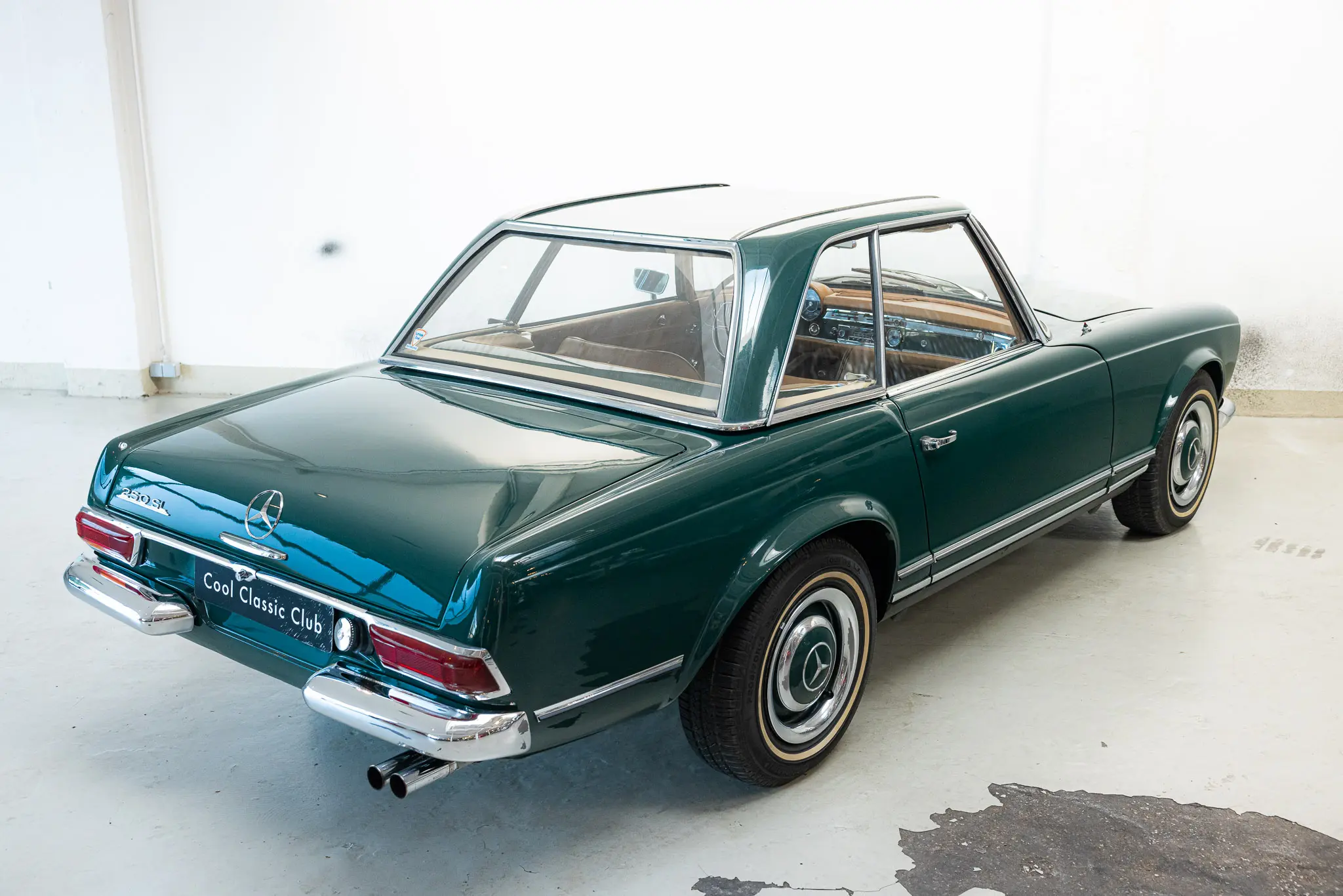 Oblique rear view with hard top on of an Mercedes-Benz 250 SL Factory 5 Speed