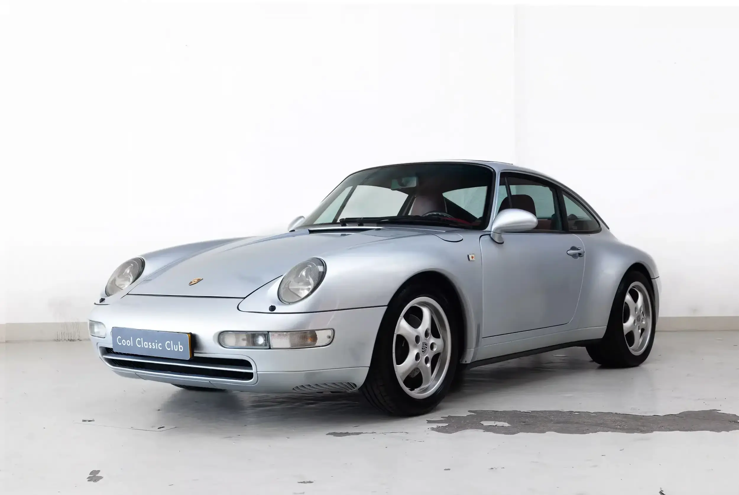 Front oblique view of the 1994 Polarsilber Metallic Porsche 993 Carrera 2 