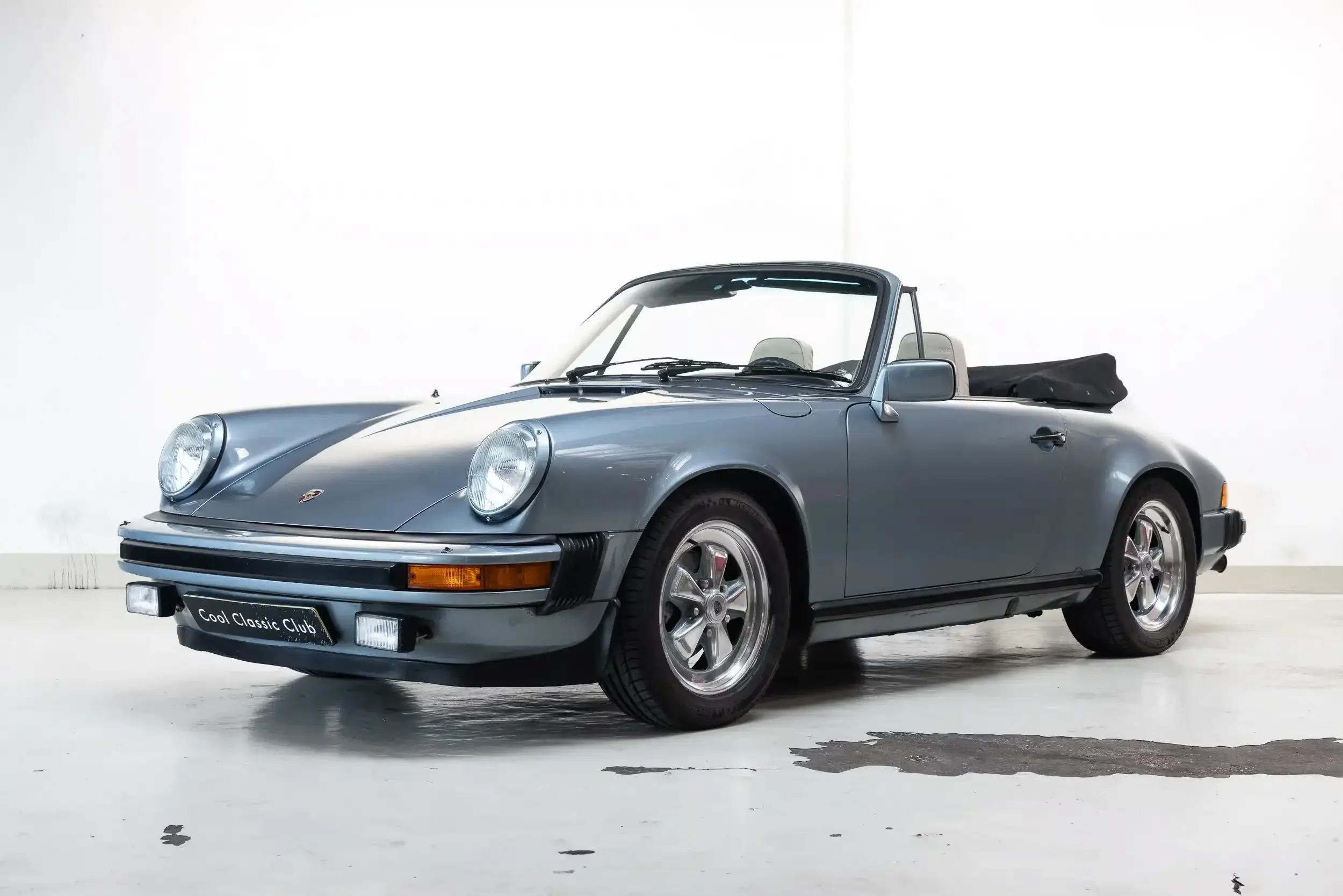 Front oblique view of the 1983 Schieferblau Metallic Porsche 911 SC 3.0 Cabriolet