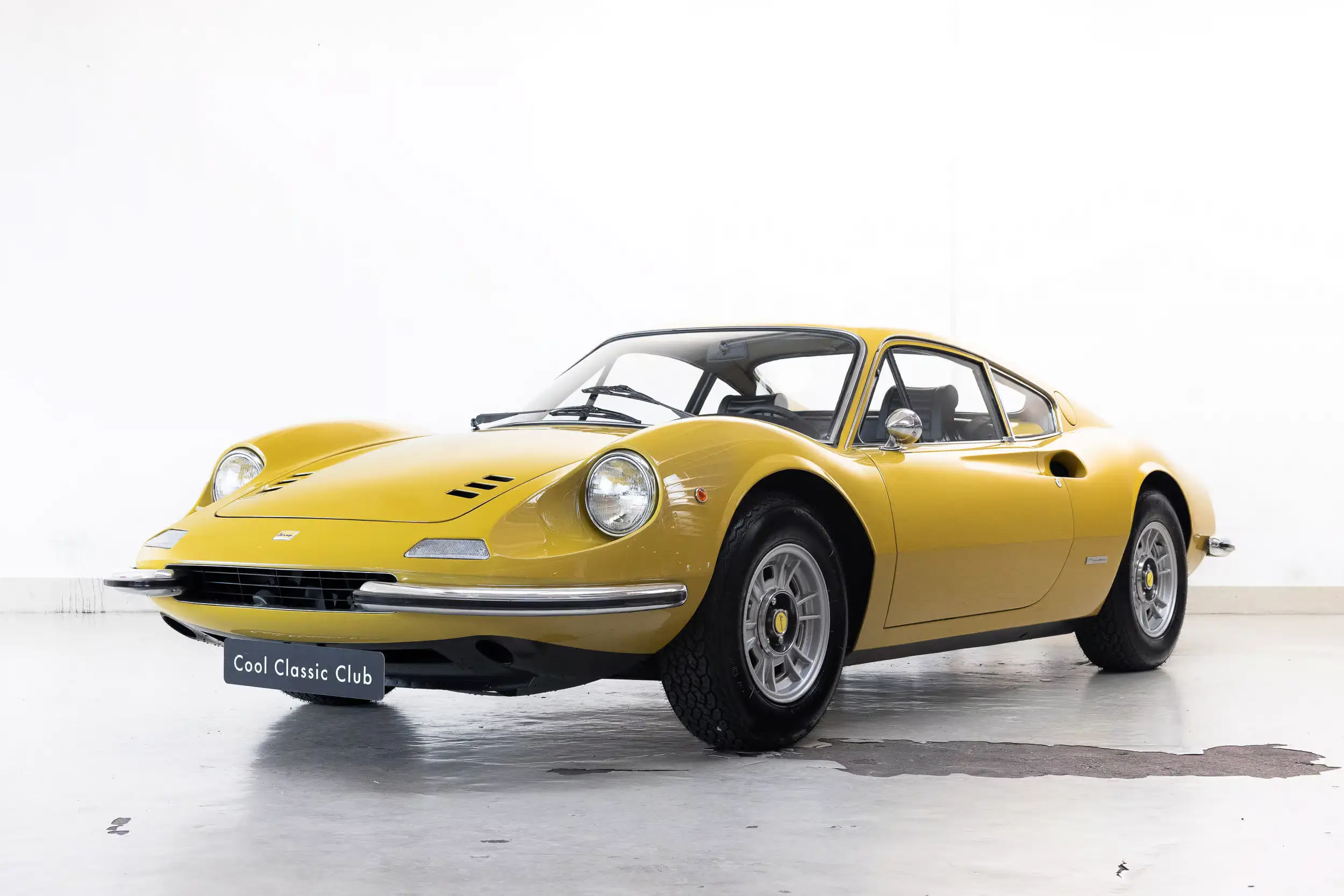 Front oblique view of the 1970 Giallo Senape Ferrari Dino 246 GT