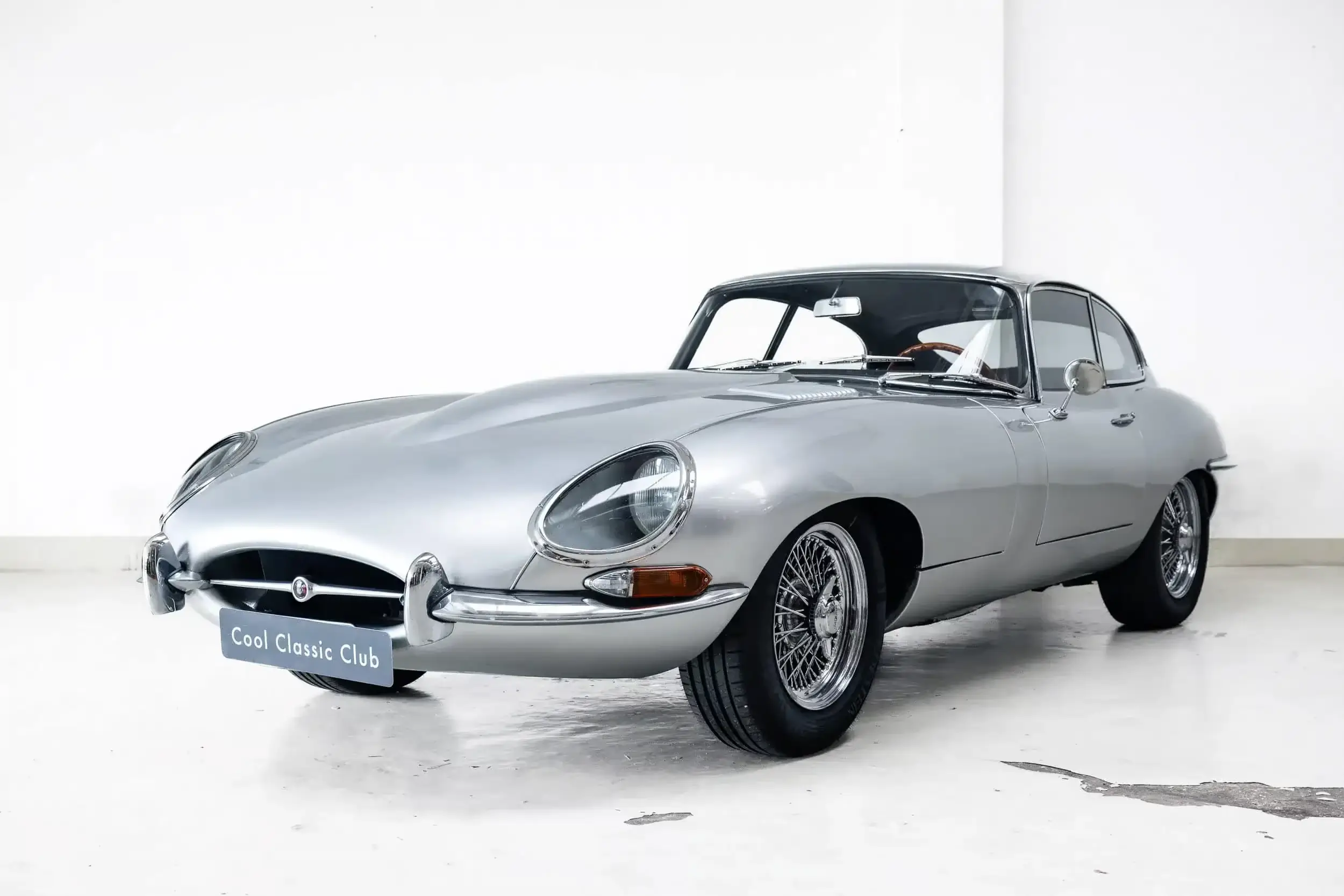 Front oblique view of the 1962 Silver Jaguar E-Type 3.8 FHC