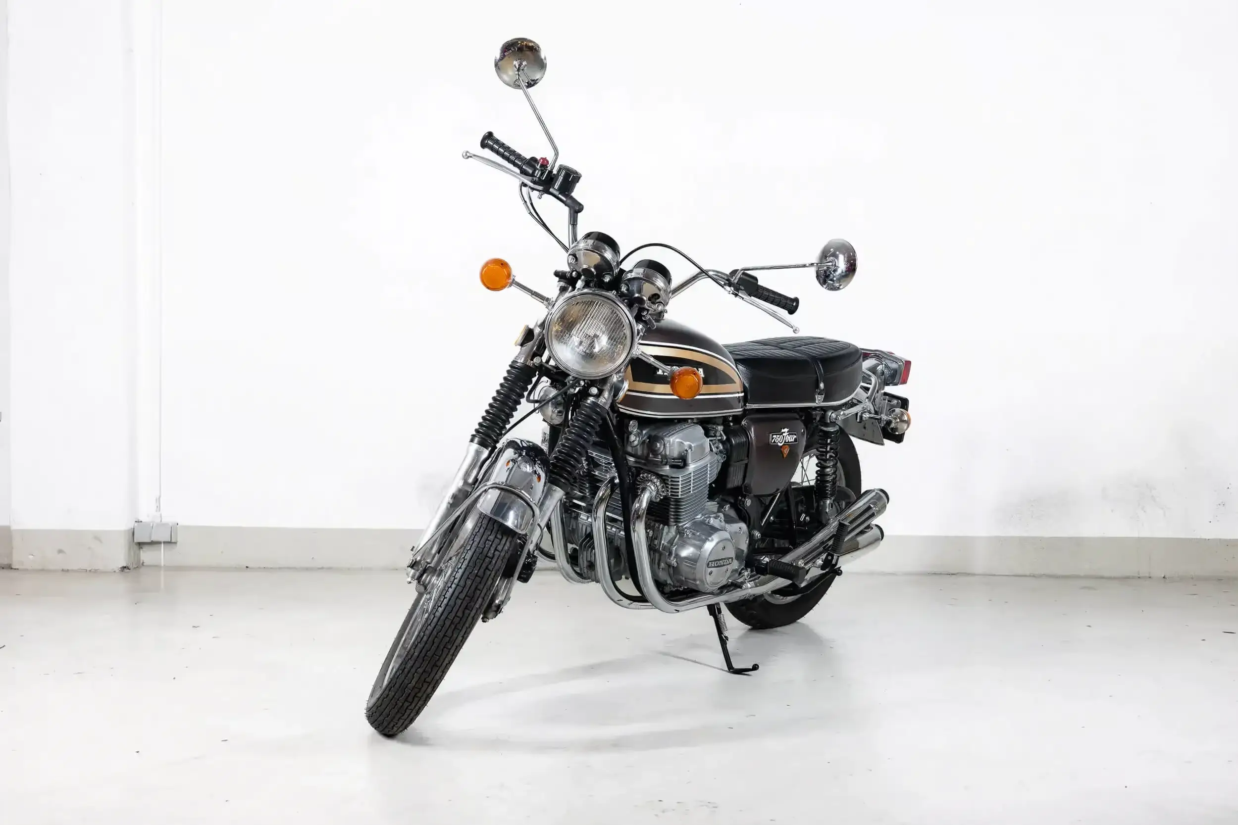 Front oblique view of the 1973 Maxim Brown metallic over Gold Honda CB 750 Four