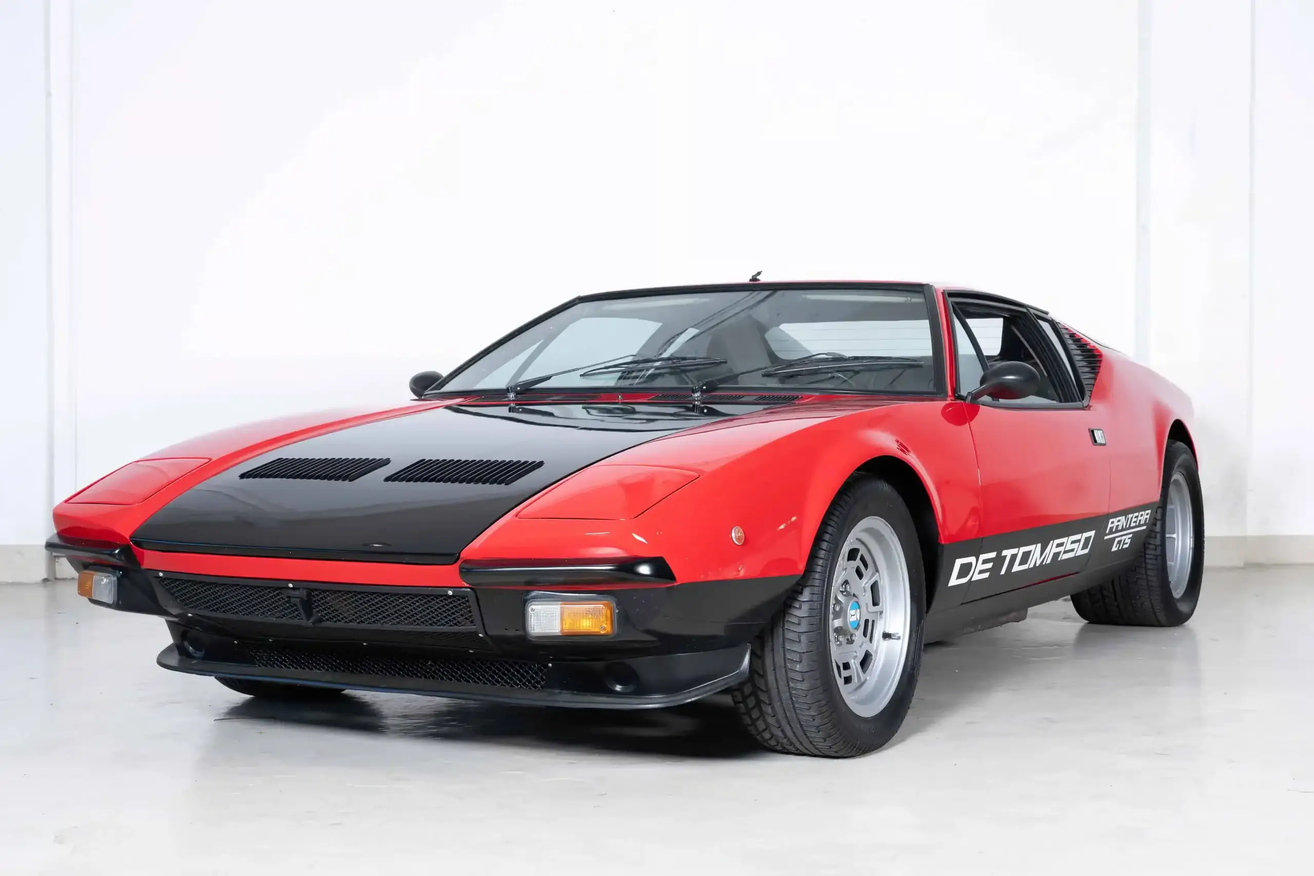 Front oblique view of the 1981 Red over Satin Black De Tomaso Pantera GTS