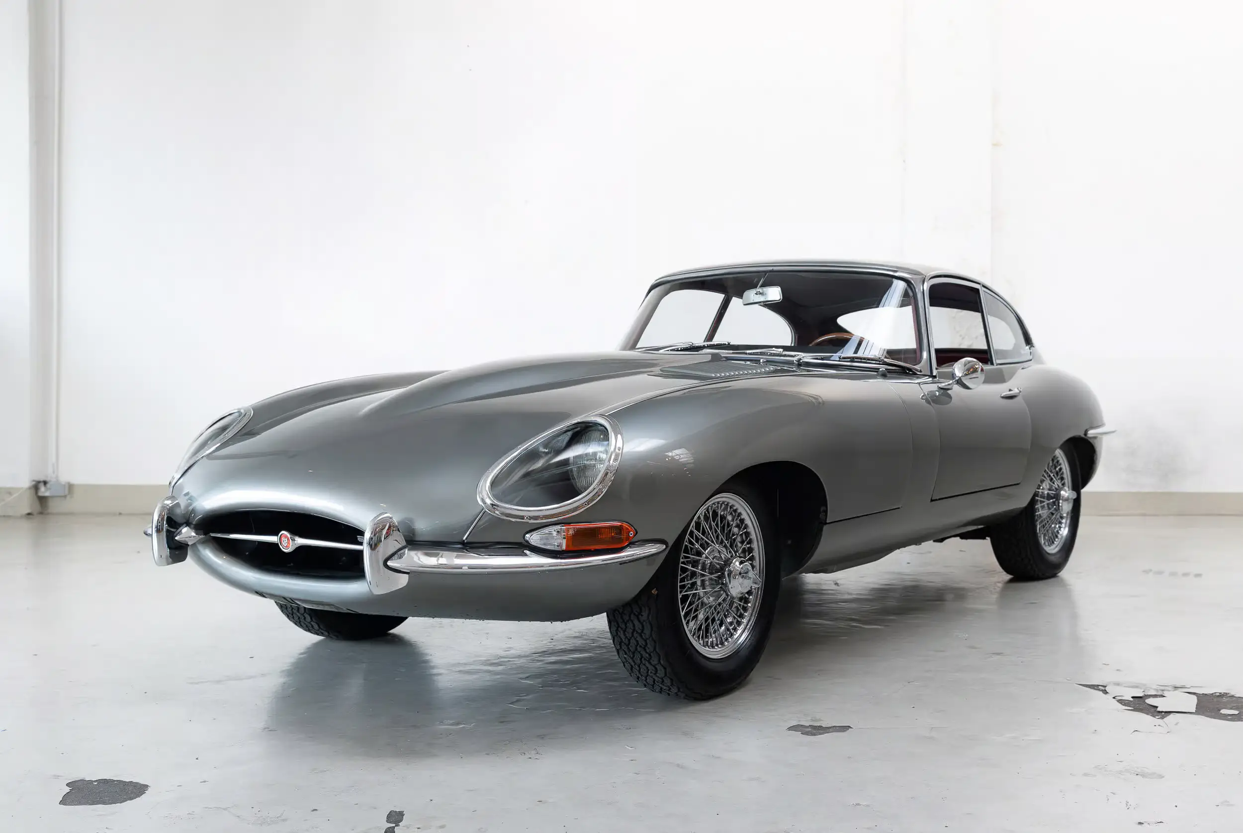 Front oblique view of the 1963 Opalescent Gunmetal  Jaguar E-Type Series 1 FHC
