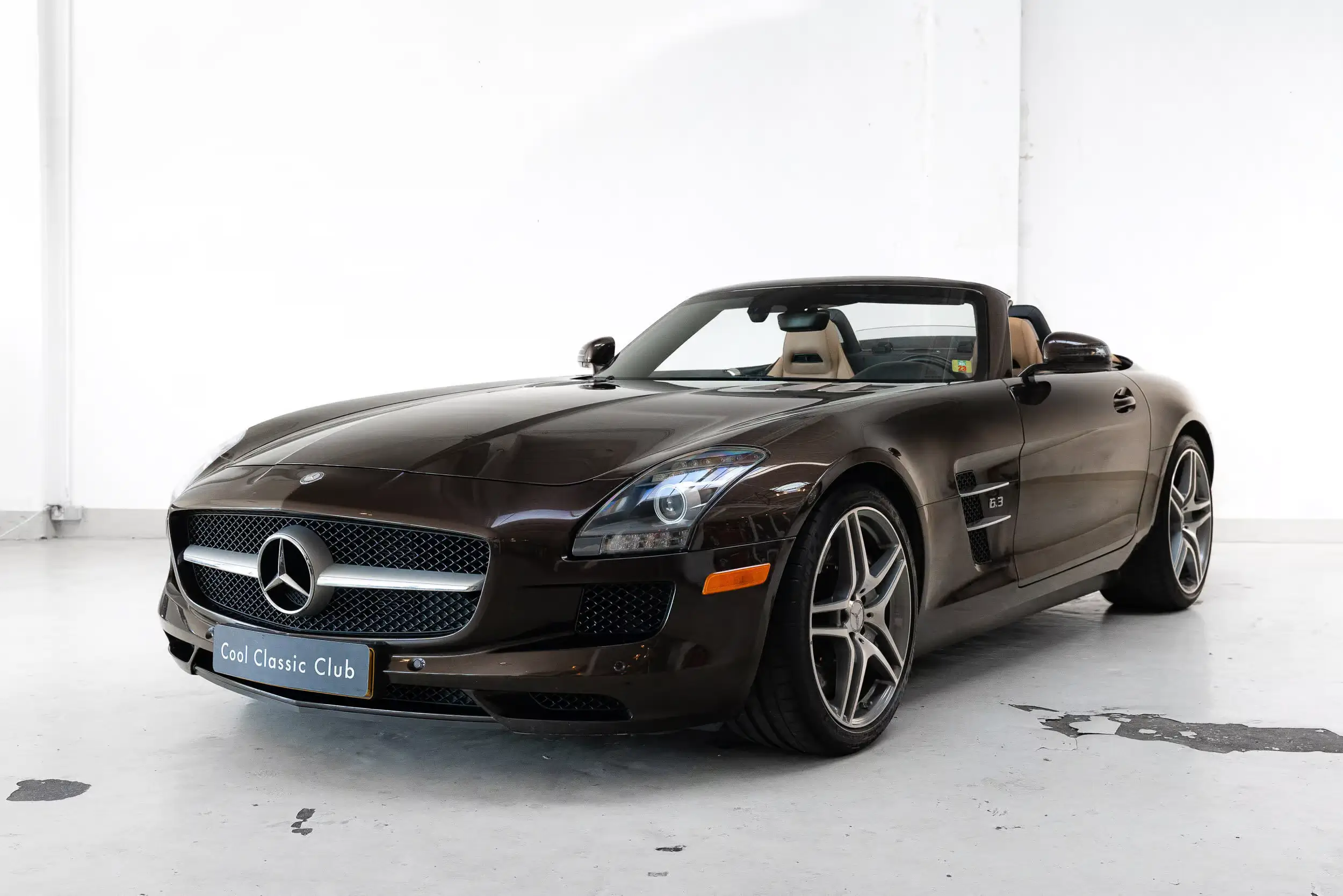 Front oblique view of the 2012 Rocky Mountains Dark Brown Mercedes-Benz SLS AMG Roadster