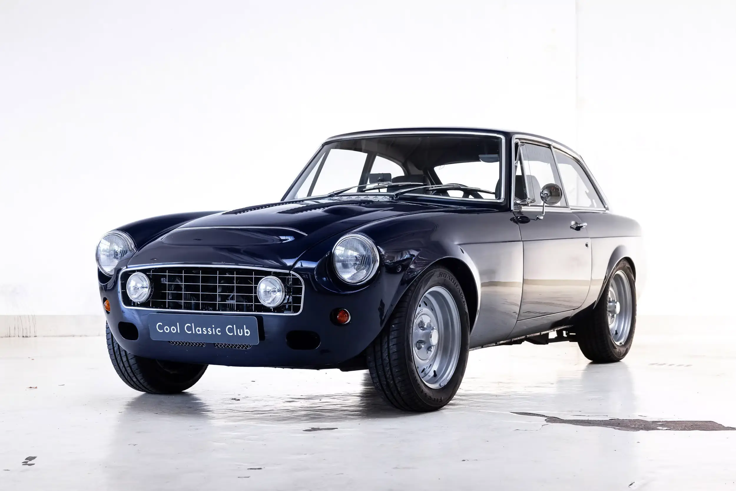 Front oblique view of the 1976 Blu Pozzi MG B GT V8 Restomod