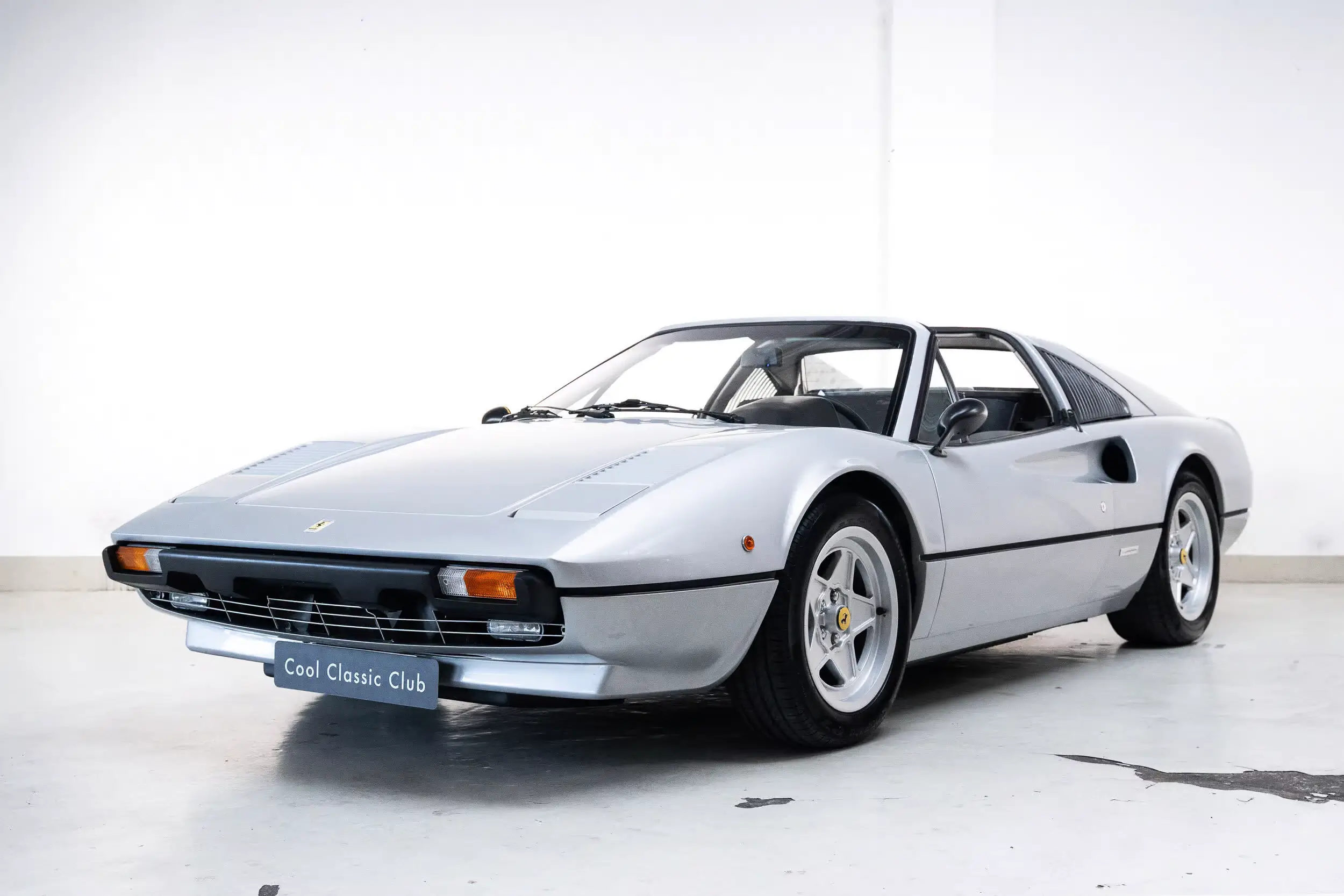 Front oblique view of the 1979 Argento Auteuil  Ferrari 308 GTS