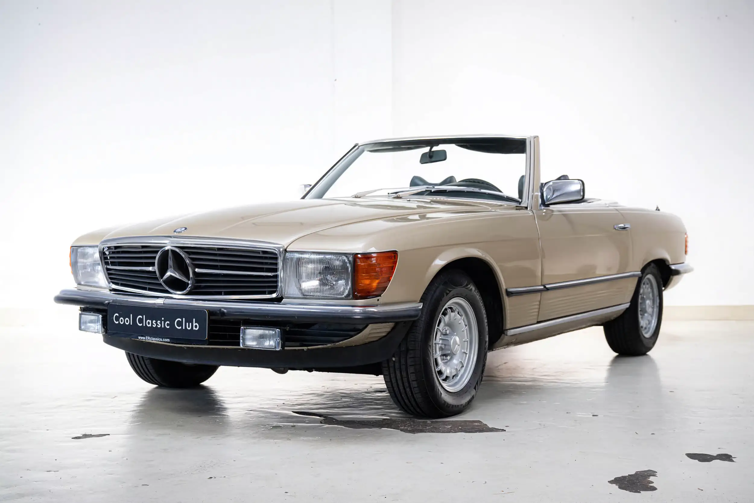 Front oblique view of the 1978 Gold metallic Mercedes-Benz SL 350 R107