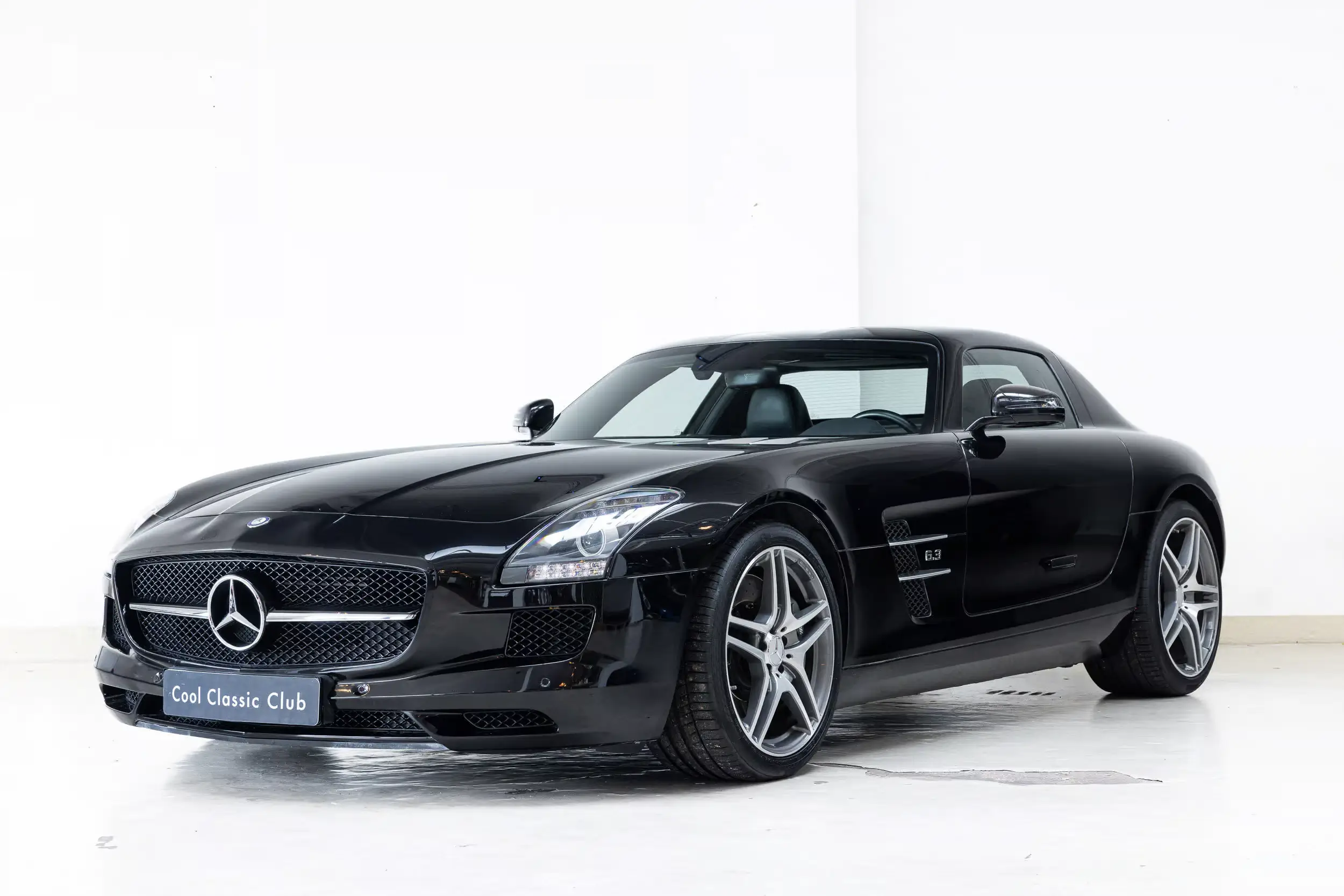 Front oblique view of the 2010 Obsidian Black Mercedes-Benz SLS AMG 