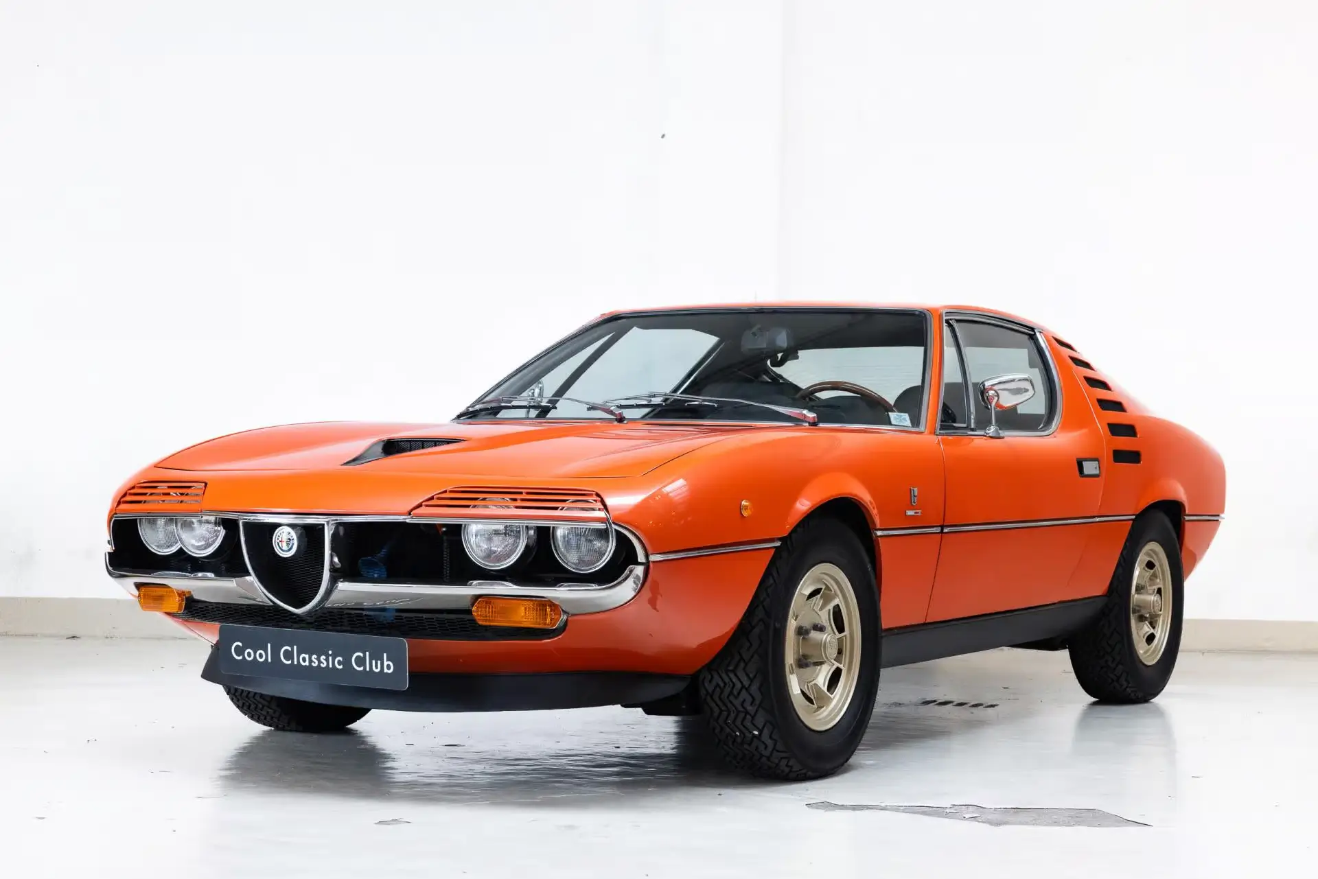 Front oblique view of the 1973 Orange Metallic 602 Alfa Romeo Montreal 