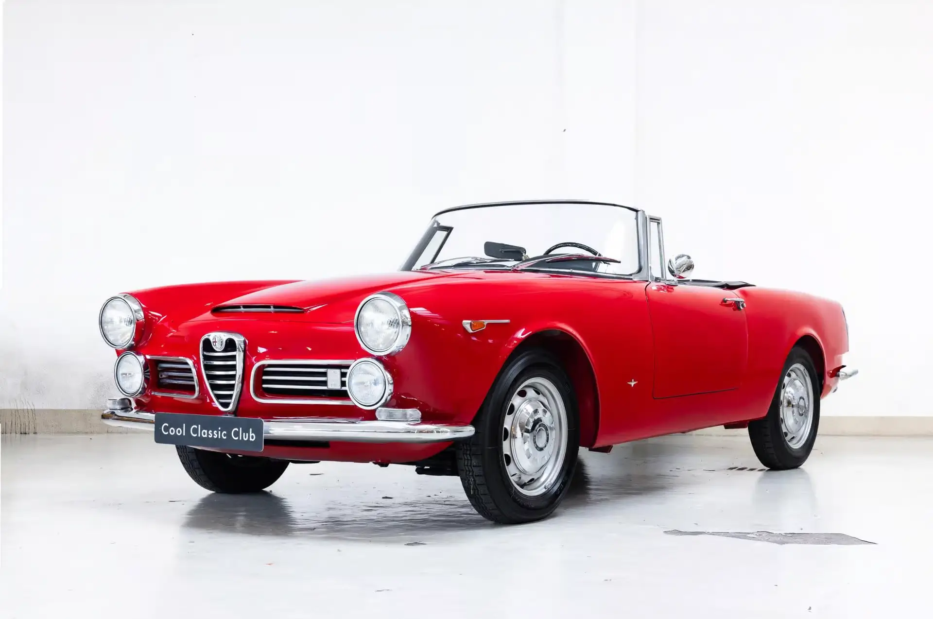Front oblique view of the 1965 Rosso Farina Alfa Romeo 2600 Touring