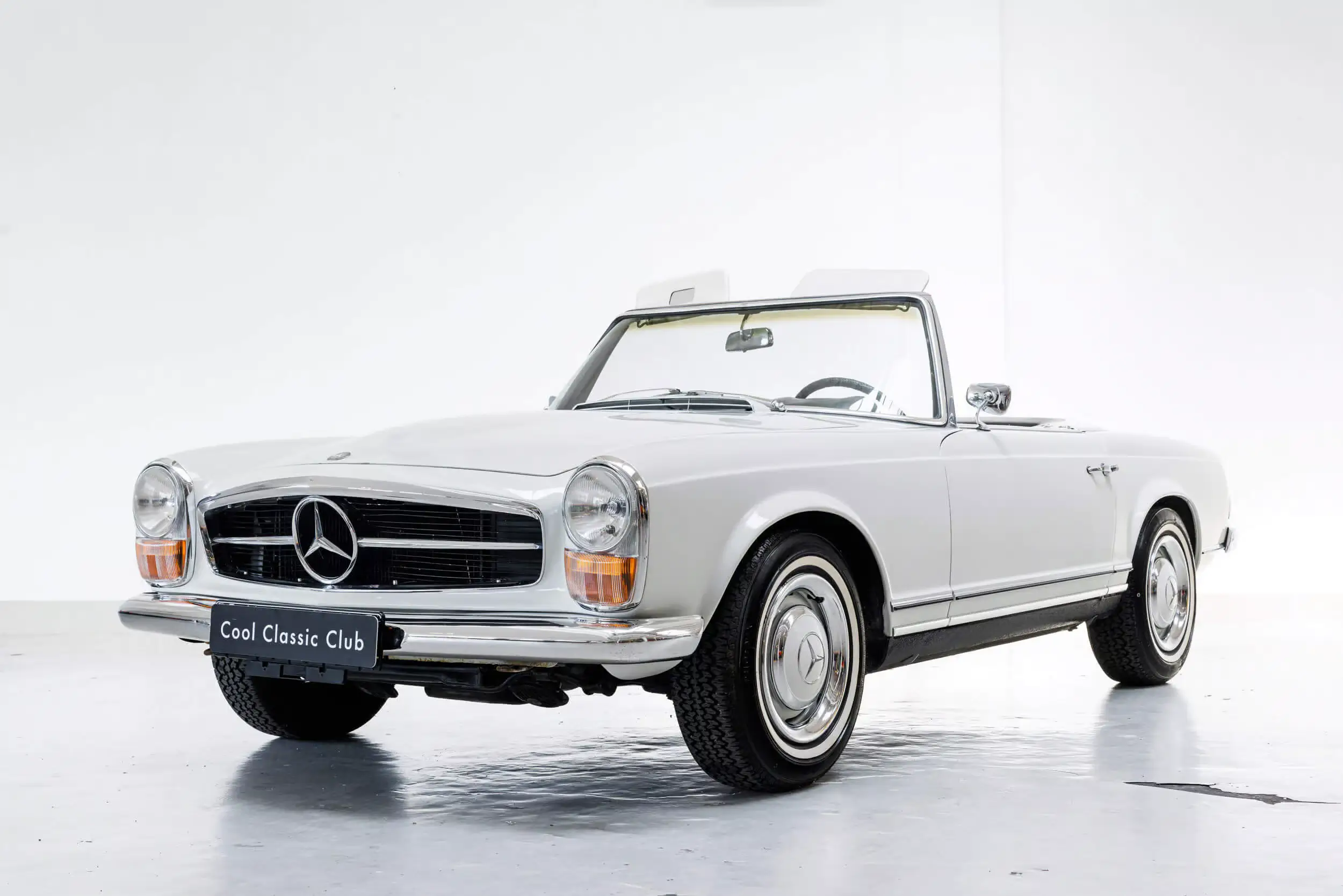 Front oblique view of the 1967 Papyrus White Mercedes-Benz 250SL Pagode