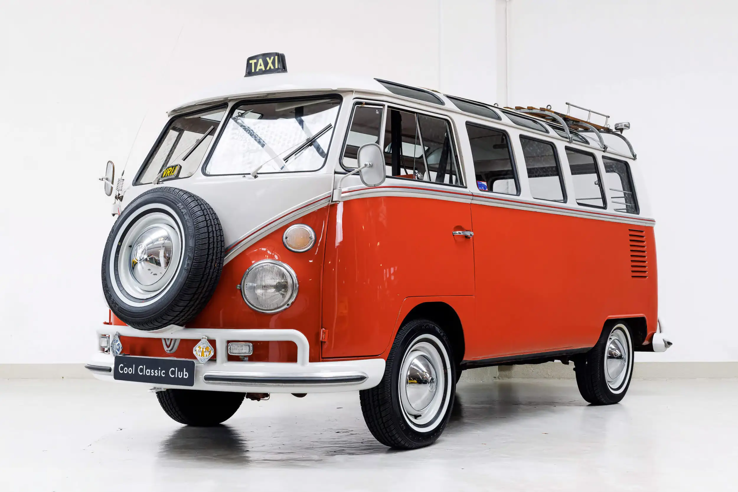 Front oblique view of the 1965 Orange & White Volkswagen T1 Samba Taxi