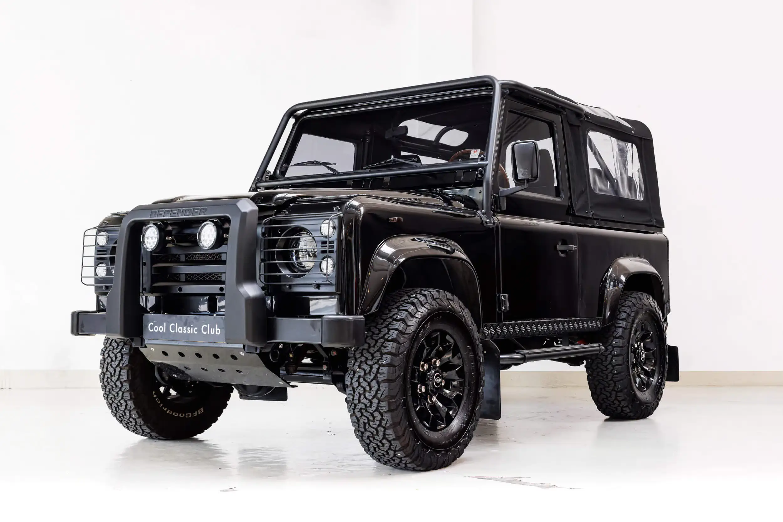 Front oblique view of the 1989 Black Land Rover Defender 90 Tophat V8