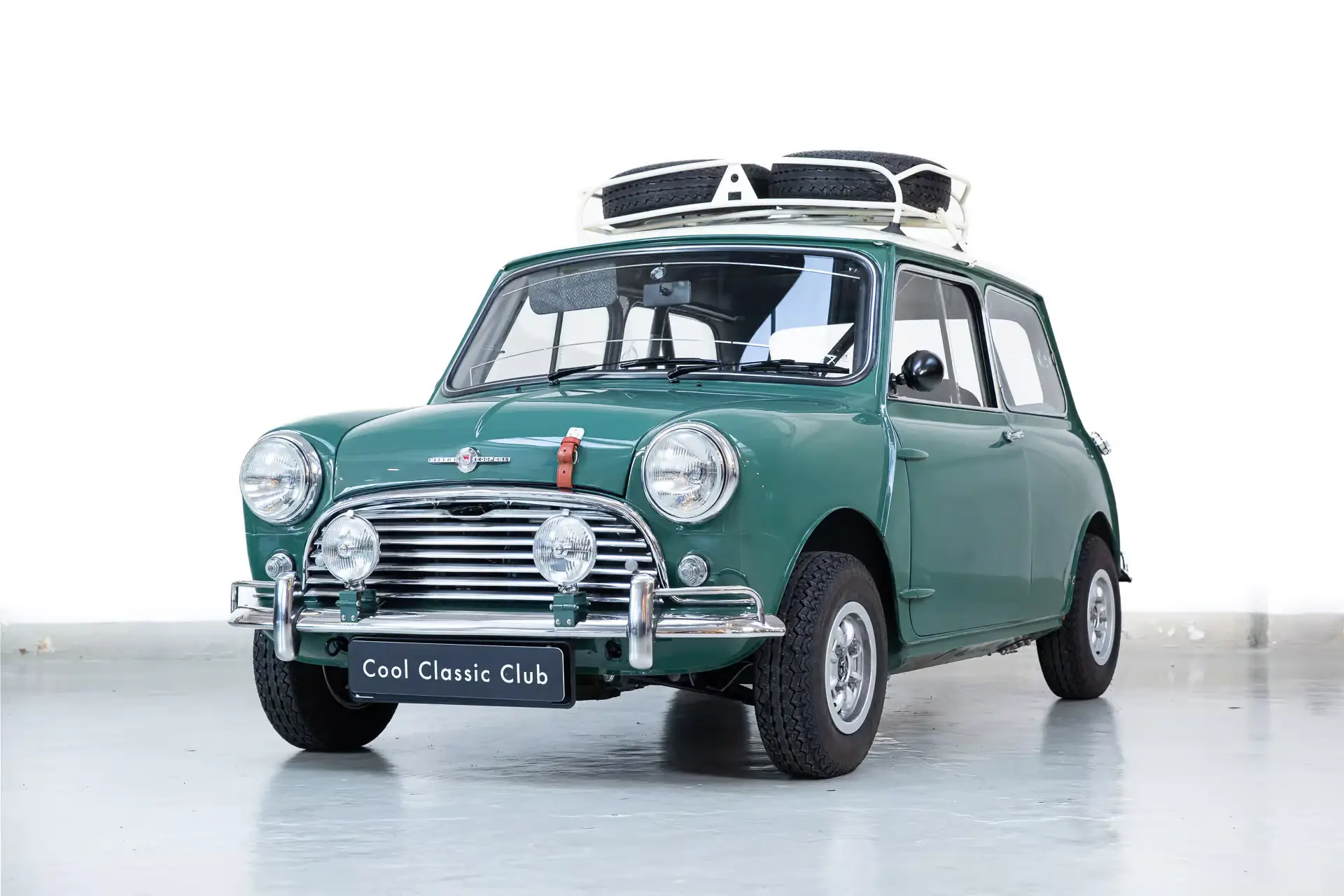 Front oblique view of the 1964 Almond Green Mini Cooper Tophat 