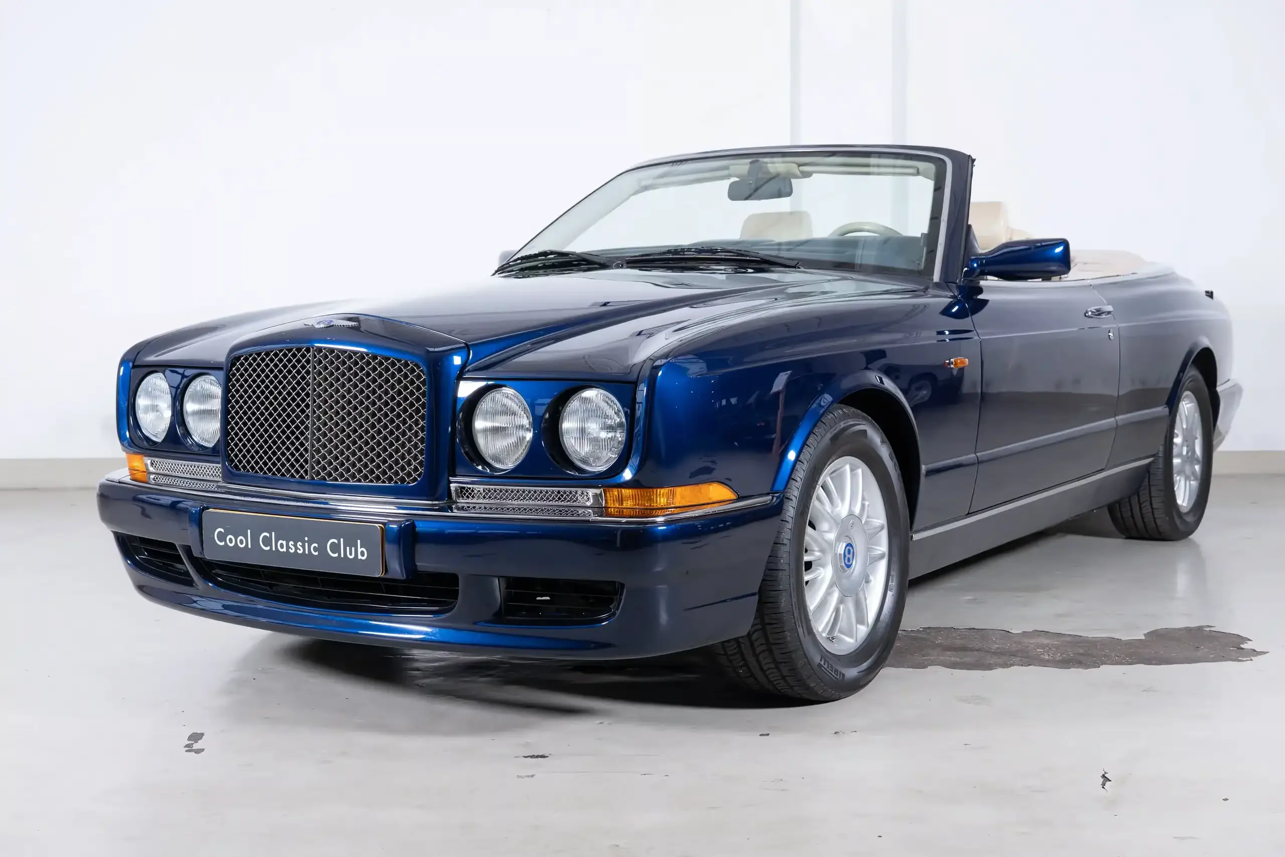 Front oblique view of the 1999 Peacock Mica  Bentley Azure 6.8 Convertible 