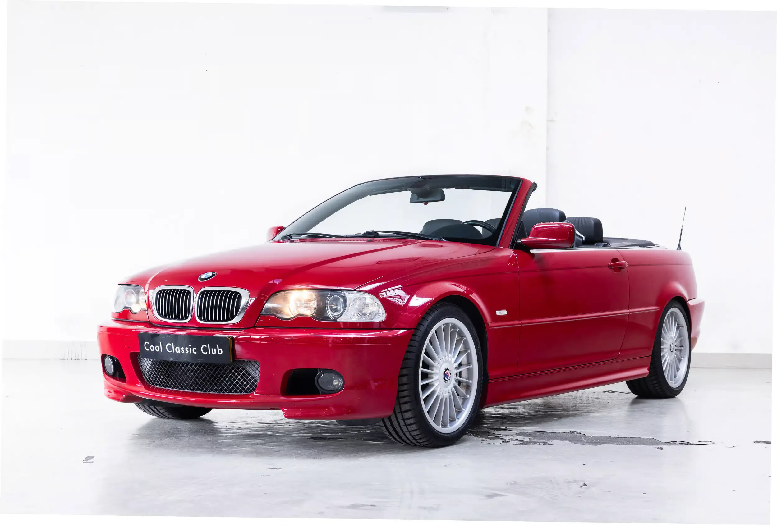 Front oblique view of the 2003 Individual Imola Red 2 BMW E46 330 CI Cabriolet