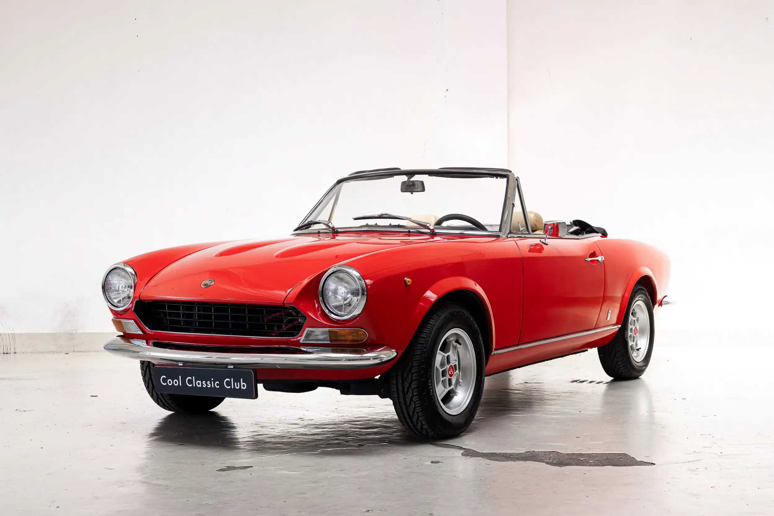 Front oblique view of the 1974 Red Fiat 124 Spider